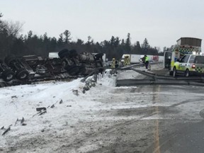 Lumber spilled across tHighway 401 following a rollover Thursday morning.