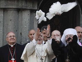 Pope Francis and Greek Catholic Archbishop Sviatoslav Shevchuk, right, release white doves during the pontiff visit to the Basilica of Santa Sofia and to the Ukrainian greek-catholic community, in Rome, Sunday, Jan. 28, 2018.