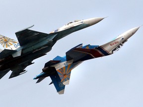 File picture taken on June 28, 2007 shows Russian military air force demonstration team perform with their SU-27 jet-fighters during the opening ceremony of the International Naval Show in St.Petersburg.