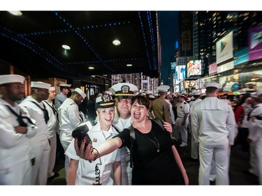 (Kathryn Mussallem in a selfie with some sailors in New York, May 2014) Kathryn Massalem: “She is a photographer who has done a lot of work documenting the Navy in the U.S. But she’s Canadian and wanted an opportunity to deploy on a Canadian ship with the Canadian Forces. She uses her time on the ship to get to know the Forces personnel and to photograph and document their daily life, as well as take some intimate portraits. She went from San Diego to Pearl Harbour aboard HMCS Calgary.”