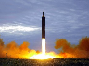 A Aug. 29, 2017 file photo distributed by the North Korean government shows what was said to be the test launch of a Hwasong-12 intermediate range missile in Pyongyang, North Korea.