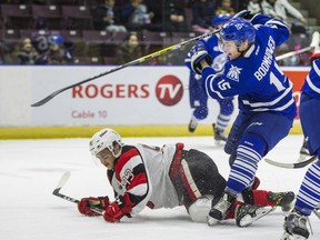 Shaw Boomhower, then with Mississauga, and Ottawa's Mathieu Foget collide during an OHL playoff game last March. Ernest Doroszuk/Postmedia