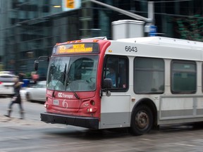 An OC Transpo bus driving along Albert St.
