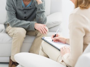 Young man in meeting with a psychologist in her office