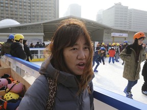 In this Saturday, Jan. 20, 2018, photo, South Korean Oh Ju-yeon, 46, speaks during an interview in Seoul, South Korea. South Koreans seem generally happy they'll see the North Koreans at their Olympics, but aren't as pleased about sharing a team with them. "I think it will be emotionally moving to watch the athletes of both Koreans march under the same flag during the opening ceremony as we come from the same nation," she said.