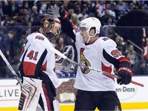 Senators goaltender Craig Anderson and centre Matt Duchene celebrate following the team's victory against the Maple Leafs in Toronto on Jan. 10.