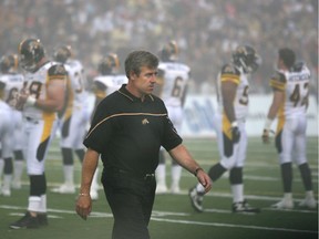 Greg Marshall, then head coach of the Hamilton Tiger-Cats, walks across the field in Halifax before the kickoff of Touchdown Atlantic, a one-off CFL game against the Toronto Argonauts at Husky Stadium in Halifax, on June 2005. DARREN CALABRESE/Postmedia files