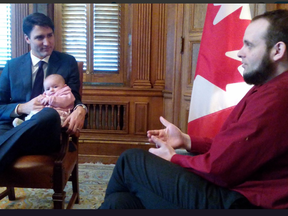 Prime Minister Justin Trudeau with Joshua Boyle and one of Boyle's children during a meeting in December at Parliament Hill.
