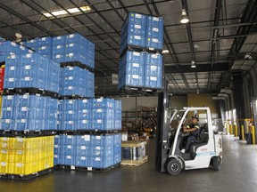 FILE - In this Friday June 2, 2017, file photo, crates of U.S. manufactured parts are prepared for shipment into Mexico at Freight Dispatch Service Agency LTD in Pharr, Texas. A big reason for the success of many investors' 401(k) accounts is how much U.S. companies are benefiting from other countries' economies doing better. There is some concern that a White House led by an "America First" ethos could enact barriers to trade that hurt companies' sales outside the country.