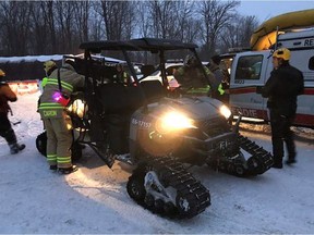 Ottawa firefighters work at the scene after ATV riders went through the ice at Mud Pond on Thursday, Jan. 4, 2018.
