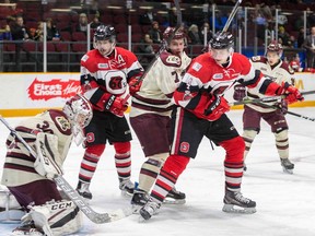 Ottawa 67's players Austen Keating (9) and Quinn Yule (4) look on as Peterborough Petes goaltender Dylan Wells makes a save during an Ontario Hockey League game at Ottawa on Saturday, Jan. 6, 2018. Also in the photo are Petes players Gleb Babintsev (7) and Nick Robertson (16). Valerie Wutti/Blitzen Photography/OSEG