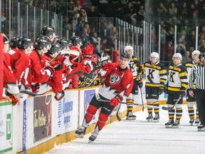 67's centre Sasha Chmelevski (8) celebrates at the bench after scoring a goal to tie the game against the Frontenacs late in the third period. Val Wutti/Blitzen Photography/OSEG