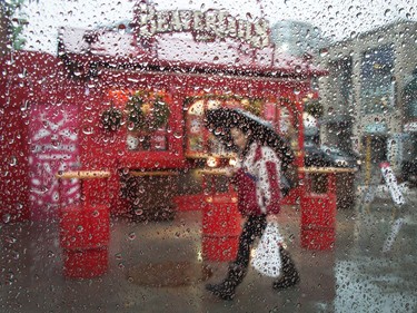 A wet car window and the Beavertails kiosk in the Byward Market makes for a fun image as the region experiences a wide range of temperatures on Friday.