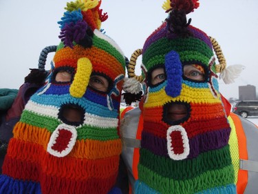 Judy Piel, left, and her husband Harold Piel volunteer at the Winterlude Triathlon on the Rideau Canal skateway in Ottawa on Saturday, February 3, 2018.