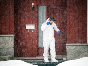 Ottawa Police Service's major crime unit is investigating a murder-suicide in the 100 block of MacFarlane Road for a female and male who had been shot Sunday Feb. 4, 2018. A forensic identification officer leaves the home where the shooting took place.