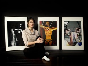 Artist May Mutter with photographs of three people she painted to show what their concussions felt like. Mutter did 40 such body paintings for her book, A Caged Mind.