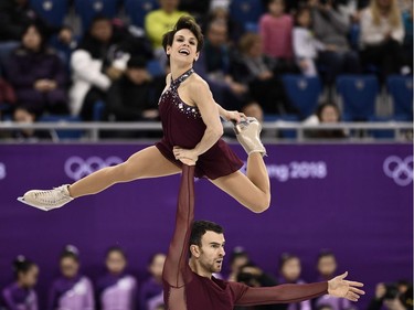 TOPSHOT - Canada's Meagan Duhamel and Canada's Eric Radford compete in the figure skating team event pair skating free skating during the Pyeongchang 2018 Winter Olympic Games at the Gangneung Ice Arena in Gangneung on February 11, 2018.