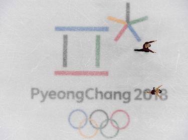 TOPSHOT - Canada's Meagan Duhamel and Canada's Eric Radford compete in the figure skating team event pair skating free skating during the Pyeongchang 2018 Winter Olympic Games at the Gangneung Ice Arena in Gangneung on February 11, 2018.