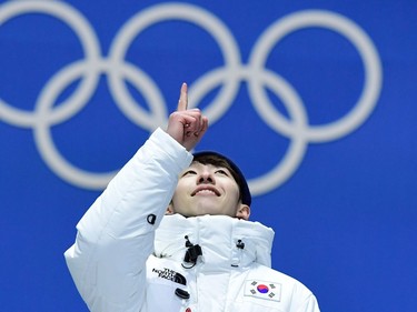 TOPSHOT - South Korea's gold medallist Lim Hyo-jun celebrates on the podium during the medal ceremony for the Men's short track 1500m at the Pyeongchang Medals Plaza during the Pyeongchang 2018 Winter Olympic Games in Pyeongchang on February 11, 2018.