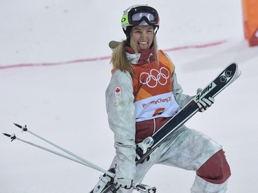 TOPSHOT - Canada's Justine Dufour-Lapointe celebrates during the victory ceremony after the women's moguls final event during the Pyeongchang 2018 Winter Olympic Games at the Phoenix Park in Pyeongchang on February 11, 2018.
