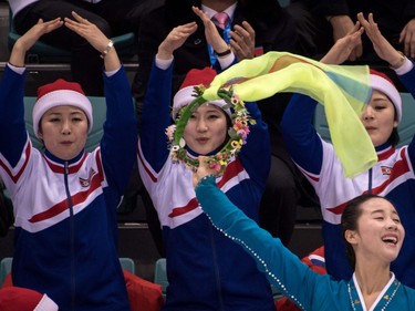 North Korean cheerleaders attend the women's preliminary round ice hockey match between Sweden and Unified Korea during the Pyeongchang 2018 Winter Olympic Games at the Kwandong Hockey Centre in Gangneung on February 12, 2018.