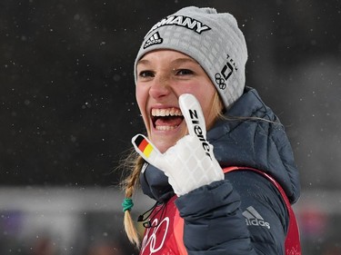 Silver medallist Germany's Katharina Althaus celebrates during the victory ceremony following the women's normal hill individual ski jumping event during the Pyeongchang 2018 Winter Olympic Games on February 12, 2018, in Pyeongchang.