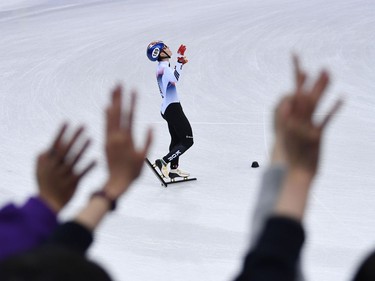 South Korea's Lim Hyojun celebrates after the men's 5,000m relay short track speed skating heat event during the Pyeongchang 2018 Winter Olympic Games, at the Gangneung Ice Arena in Gangneung on February 13, 2018.