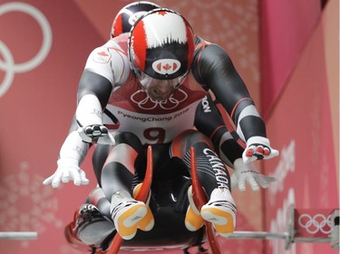 Tristan Snith and Justin Walker of Canada start their first run during the men's doubles luge final at the 2018 Winter Olympics in Pyeongchang, South Korea, Wednesday, Feb. 14, 2018.