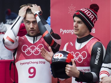 Tristan Walker, left, and Justin Snith of Canada react after competing in heat four of men's luge doubles during the 2018 Olympic Winter Games in Pyeongchang, South Korea on Wednesday, February 14, 2018. Walker and Snith finished fifth.