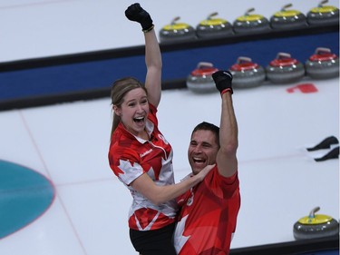 Canada's Kaitlyn Lawes and John Morris celebrate after winning the curling mixed doubles gold medal game during the Pyeongchang 2018 Winter Olympic Games at the Gangneung Curling Centre in Gangneung on February 13, 2018.