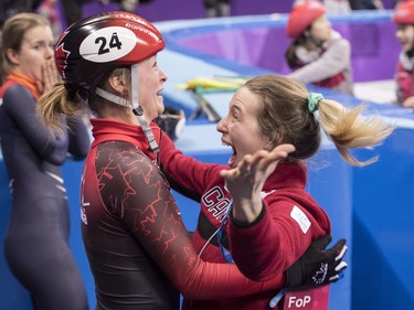 Canada's Kim Boutin is hugged by teammate Marianne St-Gelias after finding out she has won the bronze medal in the women's 500-metre short-track speedskating final at the Pyeonchang Winter Olympics Tuesday, February 13, 2018 in Gangneung, South Korea.