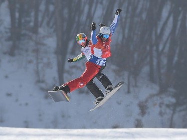 France's Pierre Vaultier (front) leads ahead of Australia's Jarryd Hughes during the men's snowboard cross big final at the Phoenix Park during the Pyeongchang 2018 Winter Olympic Games on February 15, 2018 in Pyeongchang.