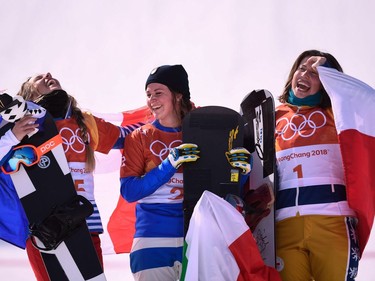 (L-R) France's Julia Pereira De Sousa Mabileau, Italy's Michela Moioli and Czech Republic's Eva Samkova celebrate on the podium during the victory ceremony after the women's snowboard cross big final at the Phoenix Park during the Pyeongchang 2018 Winter Olympic Games on February 16, 2018 in Pyeongchang.