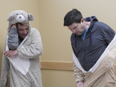 (L-R) Chris King and Mark Seaby, volunteers from Chinatown Showboat dragon boat team dresses up as one of twelve Chinese zodiac characters prior to Chinese New Year celebration at Plant recreation centre on Saturday, Feb. 17, 2018.