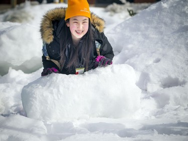 14-year-old Cynthia Lem put her muscles behind moving a big chunk of ice and snow to her snowman building spot. 
The Crackup Snowmania Challenge took place Saturday Feb 17, 2018 at Lansdowne Park.