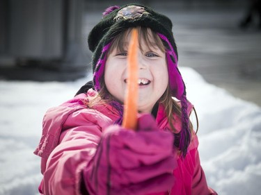 Seven and a half year old Racheal Born holds up her snowman's nose, a big carrot. The Crackup Snowmania Challenge took place Saturday Feb 17, 2018 at Lansdowne Park.
