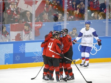 Team Canada celebrate their win against Team Korea during their game in Gangneung, South Korea, at the 2018 Winter Olympics on Sunday, Feb. 18, 2018. Leah Hennel/Postmedia