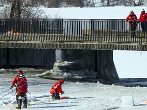 City workers set up blasting operations on the ice of the Rideau River on Sunday. Each year, the city undertakes ice-breaking operations near the Rideau Falls.  Ashley Fraser/Postmedia