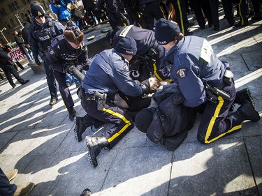 When protesters pushed past police lines, multiple arrests were made. 

Ashley Fraser/Postmedia