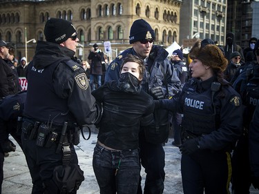 Clashes between anti-racist protestors and the RCMP happened when protesters pushed past police lines, leading to multiple arrests. 

Ashley Fraser/Postmedia