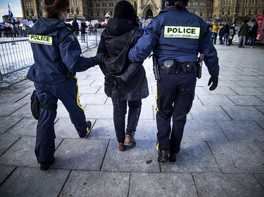 Clashes between anti racist protestors and the RCMP happened when protesters pushed past police lines, leading to multiple arrests. 

Ashley Fraser/Postmedia