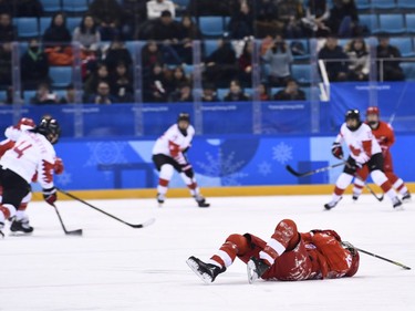 TOPSHOT - Russia's Anna Shokhina lies on the ice injured in the women's semi-final ice hockey match between Canada and the Olympic Athletes from Russia during the Pyeongchang 2018 Winter Olympic Games at the Gangneung Hockey Centre in Gangneung on February 19, 2018.