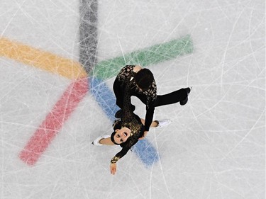 TOPSHOT - Canada's Tessa Virtue and Canada's Scott Moir compete in the ice dance short dance of the figure skating event during the Pyeongchang 2018 Winter Olympic Games at the Gangneung Ice Arena in Gangneung on February 19, 2018.