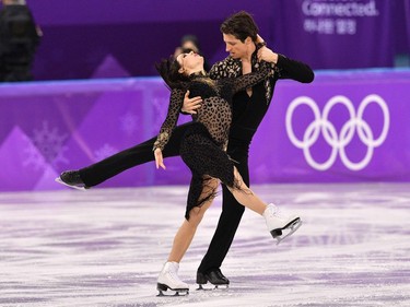 TOPSHOT - Canada's Tessa Virtue and Canada's Scott Moir compete in the ice dance short dance of the figure skating event during the Pyeongchang 2018 Winter Olympic Games at the Gangneung Ice Arena in Gangneung on February 19, 2018.