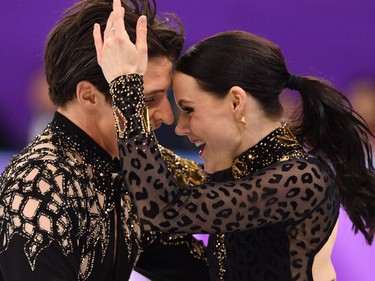 TOPSHOT - Canada's Tessa Virtue and Canada's Scott Moir compete in the ice dance short dance of the figure skating event during the Pyeongchang 2018 Winter Olympic Games at the Gangneung Ice Arena in Gangneung on February 19, 2018.