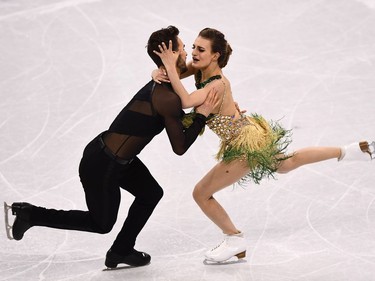 TOPSHOT - France's Gabriella Papadakis and France's Guillaume Cizeron compete in the ice dance short dance of the figure skating event during the Pyeongchang 2018 Winter Olympic Games at the Gangneung Ice Arena in Gangneung on February 19, 2018.