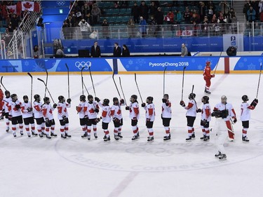 TOPSHOT - Team Canada celebrates winning the women's semi-final ice hockey match between Canada and the Olympic Athletes from Russia during the Pyeongchang 2018 Winter Olympic Games at the Gangneung Hockey Centre in Gangneung on February 19, 2018.