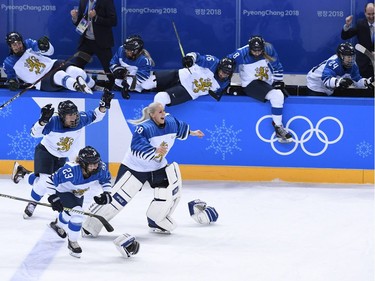 Finland's players celebrate winning the women's bronze medal ice hockey match between Finland and the Olympic Athletes from Russia during the Pyeongchang 2018 Winter Olympic Games at the Kwandong Hockey Centre in Gangneung on February 21, 2018.