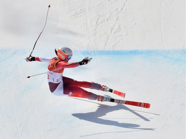 Switzerland's Michelle Gisin falls after crossing the finish line of the women's Downhill at the Jeongseon Alpine Center during the Pyeongchang 2018 Winter Olympic Games on February 21, 2018 in Pyeongchang.