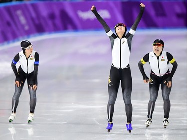 L-R: Japan's Nana Takagi, Japan's Miho Takagi and Japan's Ayano Sato celebrate their gold win in the women's team pursuit final A speed skating event during the Pyeongchang 2018 Winter Olympic Games at the Gangneung Oval in Gangneung on February 21, 2018.